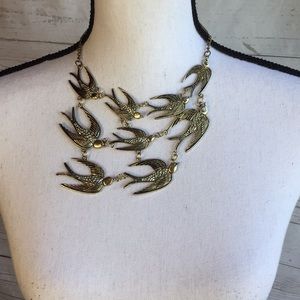 Antique gold colored swallow bird necklace